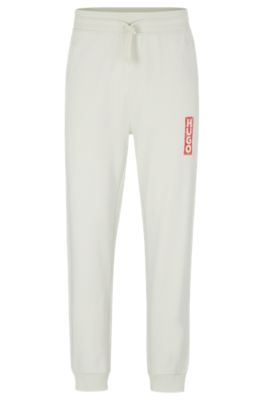 Hugo Boss Cotton-terry Tracksuit Bottoms With Vertical Logo In Light Green