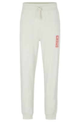 HUGO - Cotton-terry tracksuit bottoms with vertical logo