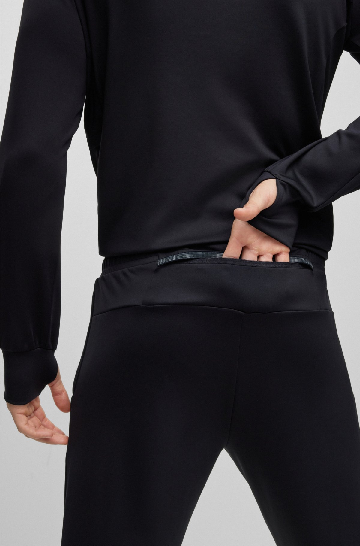 Cuffed tracksuit bottoms in active-stretch fabric, Dark Blue