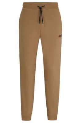 Hugo Boss Monogram-print Tracksuit Bottoms With Striped Tape In Light Brown