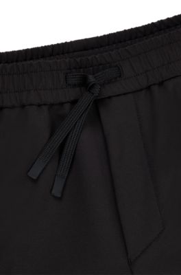 Tapered-fit chinos in easy-iron four-way stretch fabric, Black