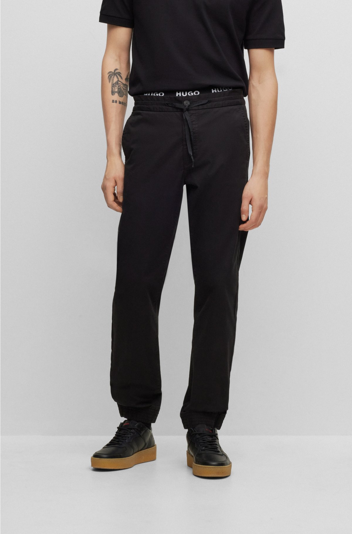 Cuffed slim-fit trousers in stretch-cotton gabardine, Black