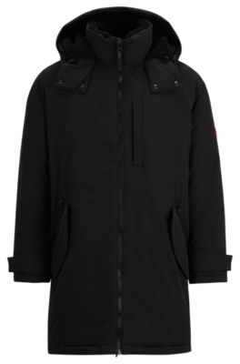 Shop Hugo Water-repellent Fishtail Parka Jacket With Logo Badge In Black