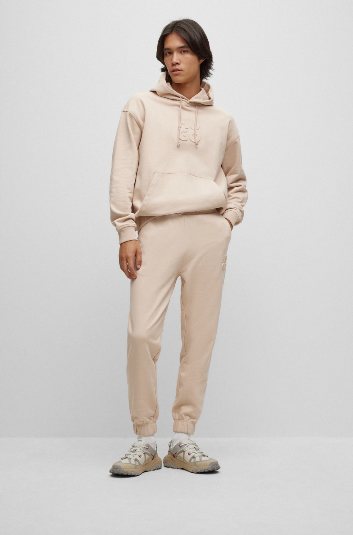 HUGO - Relaxed-fit cotton-terry tracksuit bottoms with stacked logo