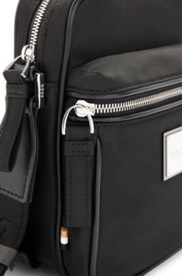 Reporter bag with metallic logo plate, Black