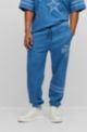 BOSS x NFL oversize-fit tracksuit bottoms in denim-look cotton, Cowboys