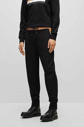 Oversize-fit tracksuit bottoms with contrast waistband, Black