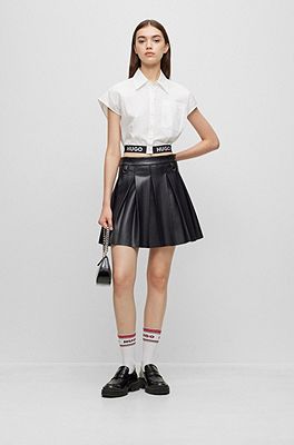 Faux Leather Pleated Flare Mini Skirt in Black