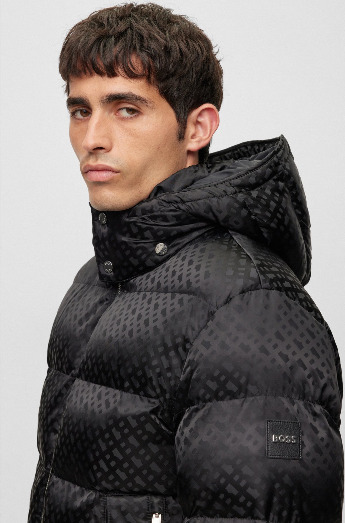 Water-repellent down jacket with monogram badge and lining