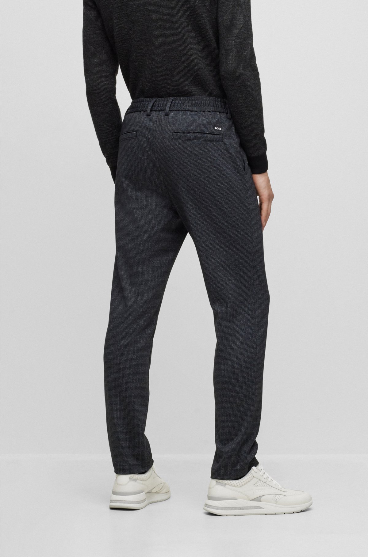 Regular tapered-fit trousers in patterned stretch jersey, Black