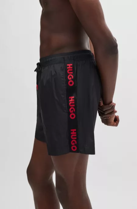 Fully lined swim shorts with logo tape