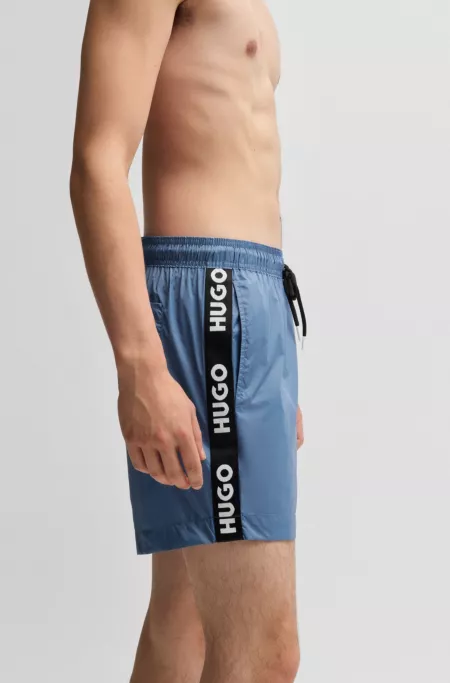 Fully lined swim shorts with logo tape