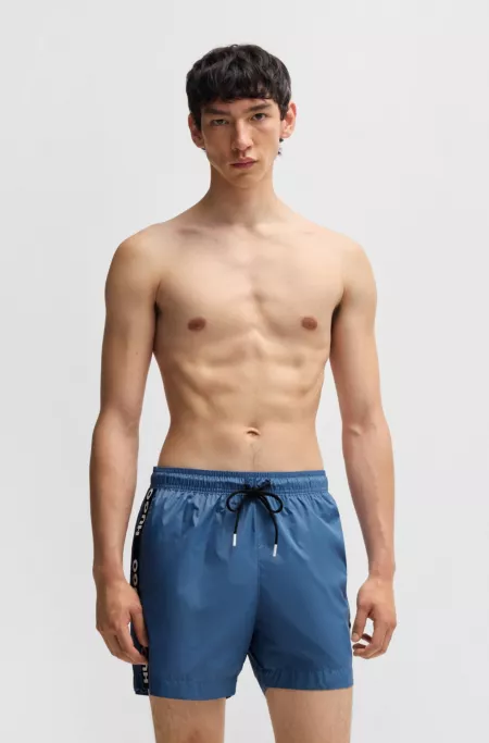 Fully lined swim shorts with logo tape