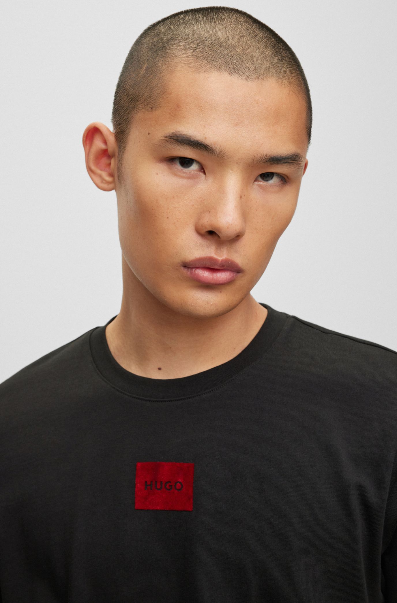 HUGO - Regular-fit T-shirt in logo flock-print cotton with