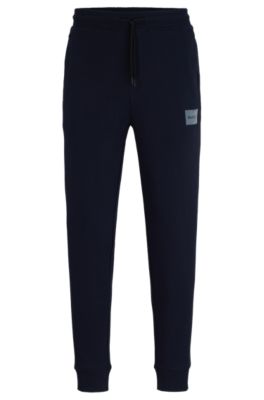 HUGO - Cotton-terry tracksuit bottoms with metallic-effect logo