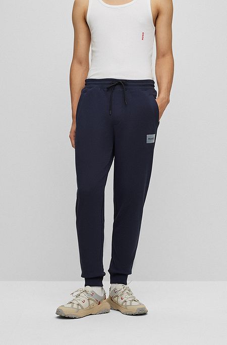 Cotton-terry tracksuit bottoms with metallic-effect logo, Dark Blue