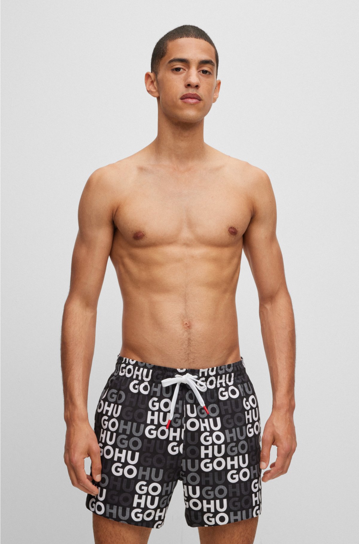 HUGO - Swim shorts with all-over logo print | Shorts