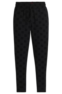 Hugo Boss Straight-leg Tracksuit Bottoms With Flock-print Stacked Logos In Black