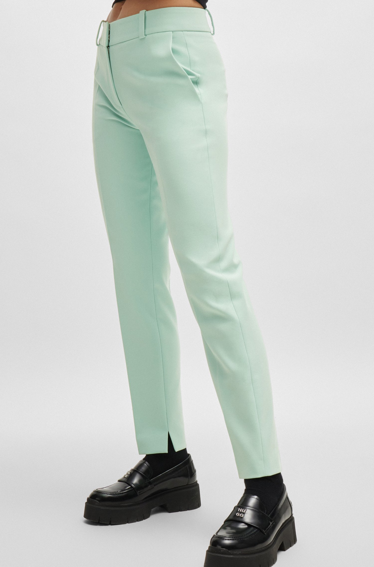Slim-fit trousers with slit hems