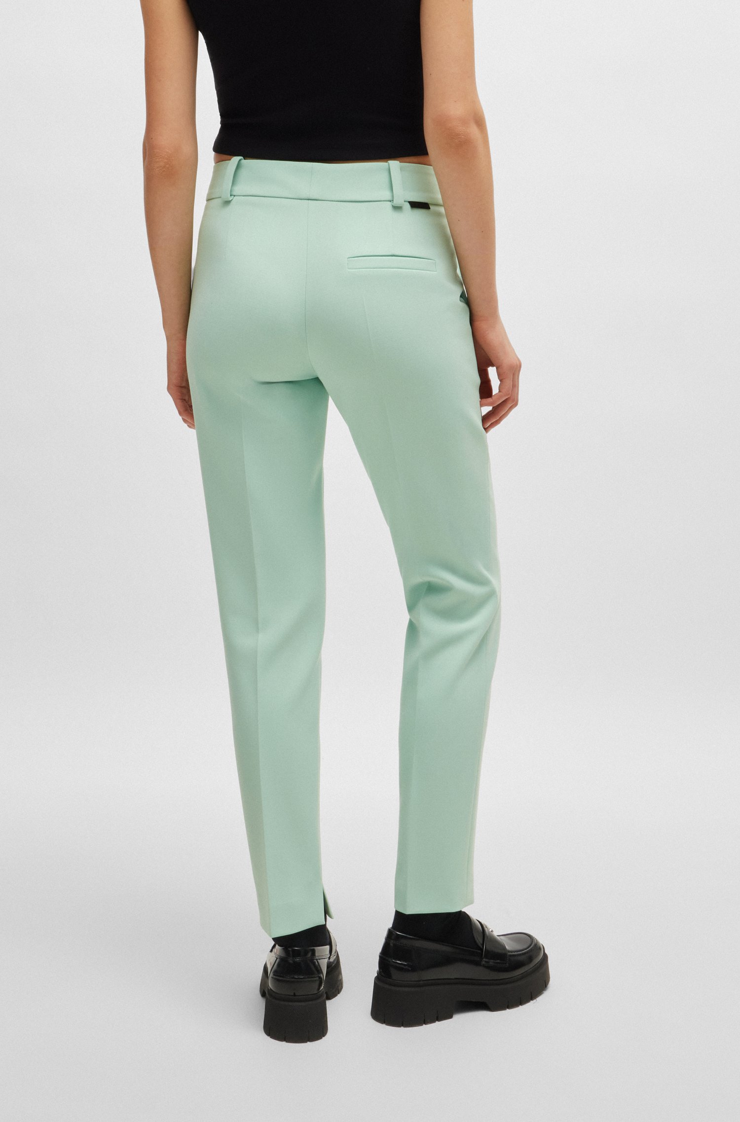 Slim-fit trousers with slit hems