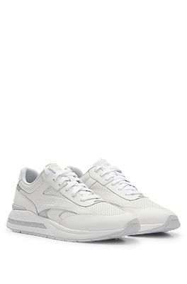 Low-top trainers with perforated and plain leather