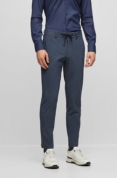 Pantalones slim fit de punto elástico técnico con microdibujo, Azul oscuro