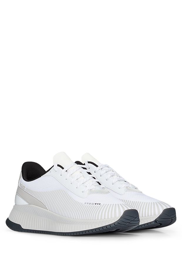 Mixed-material trainers with rubberized faux leather, White