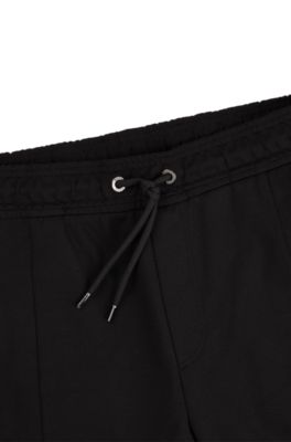 Porsche x Boss ヒューゴボス × ポルシェ パンツ　ストレッチ BOSS - Porsche x BOSS テーパードフィットジーンズ ダーク