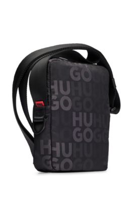 Stacked-logo-pattern reporter bag with branded rubber patch, Black