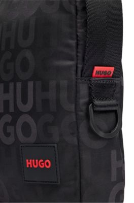 Stacked-logo-pattern reporter bag with branded rubber patch, Black