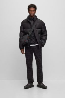 Stacked-logo-pattern reporter bag with branded rubber patch, Black