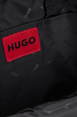 Stacked-logo-pattern backpack with branded rubber patch, Black