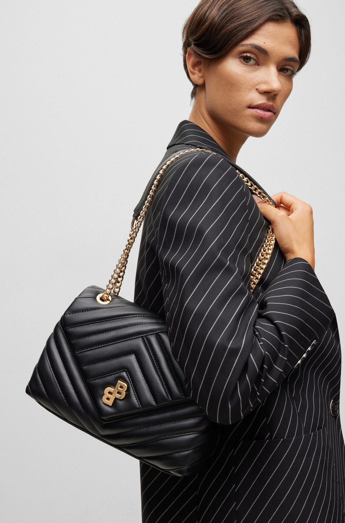 Quilted shoulder bag with monogram trim and chain, Black