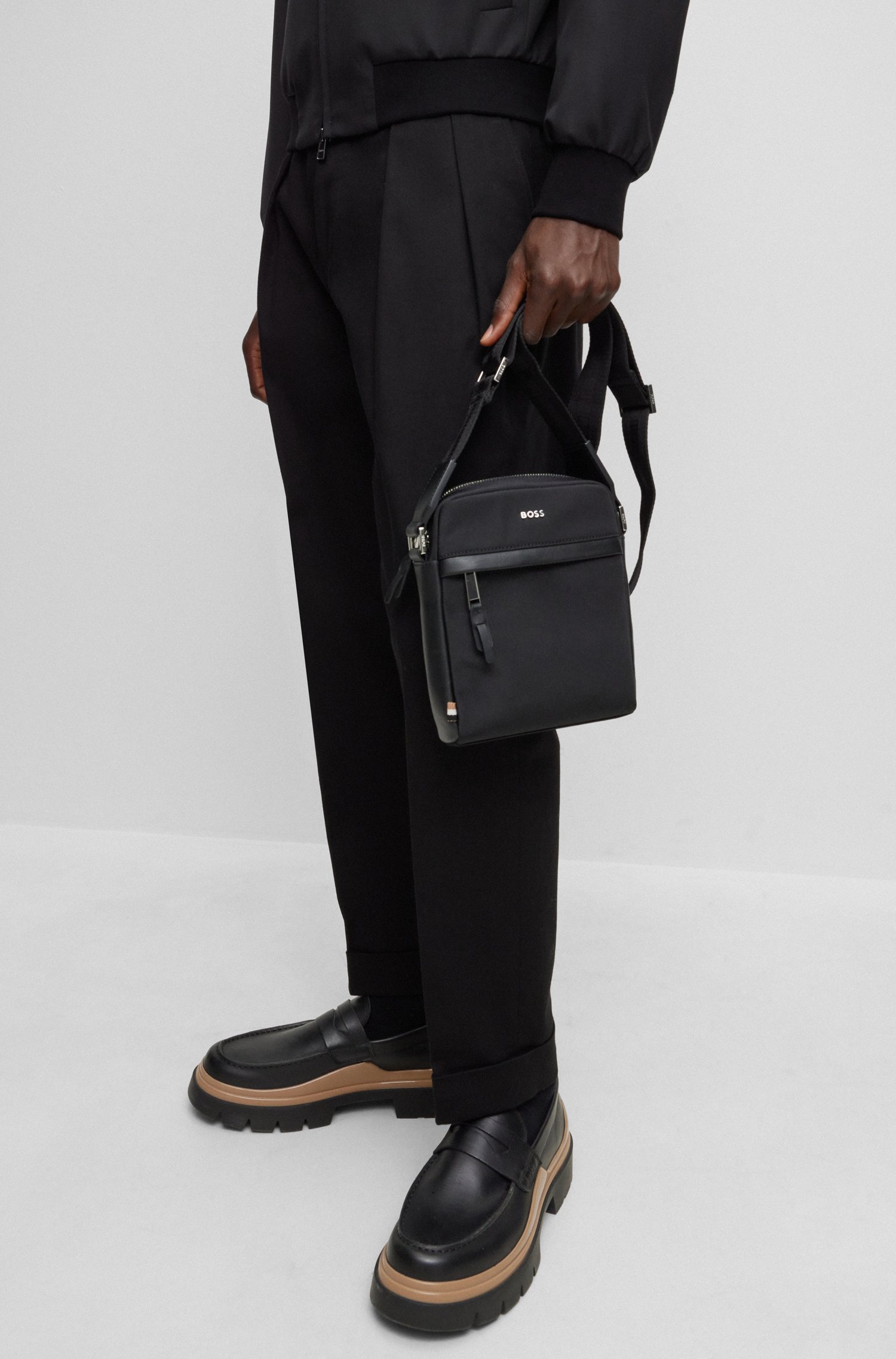 Structured-material reporter bag with logo lettering