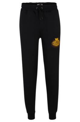 Hugo Boss Boss X Nfl Cotton-blend Tracksuit Bottoms With Collaborative Branding In Commanders