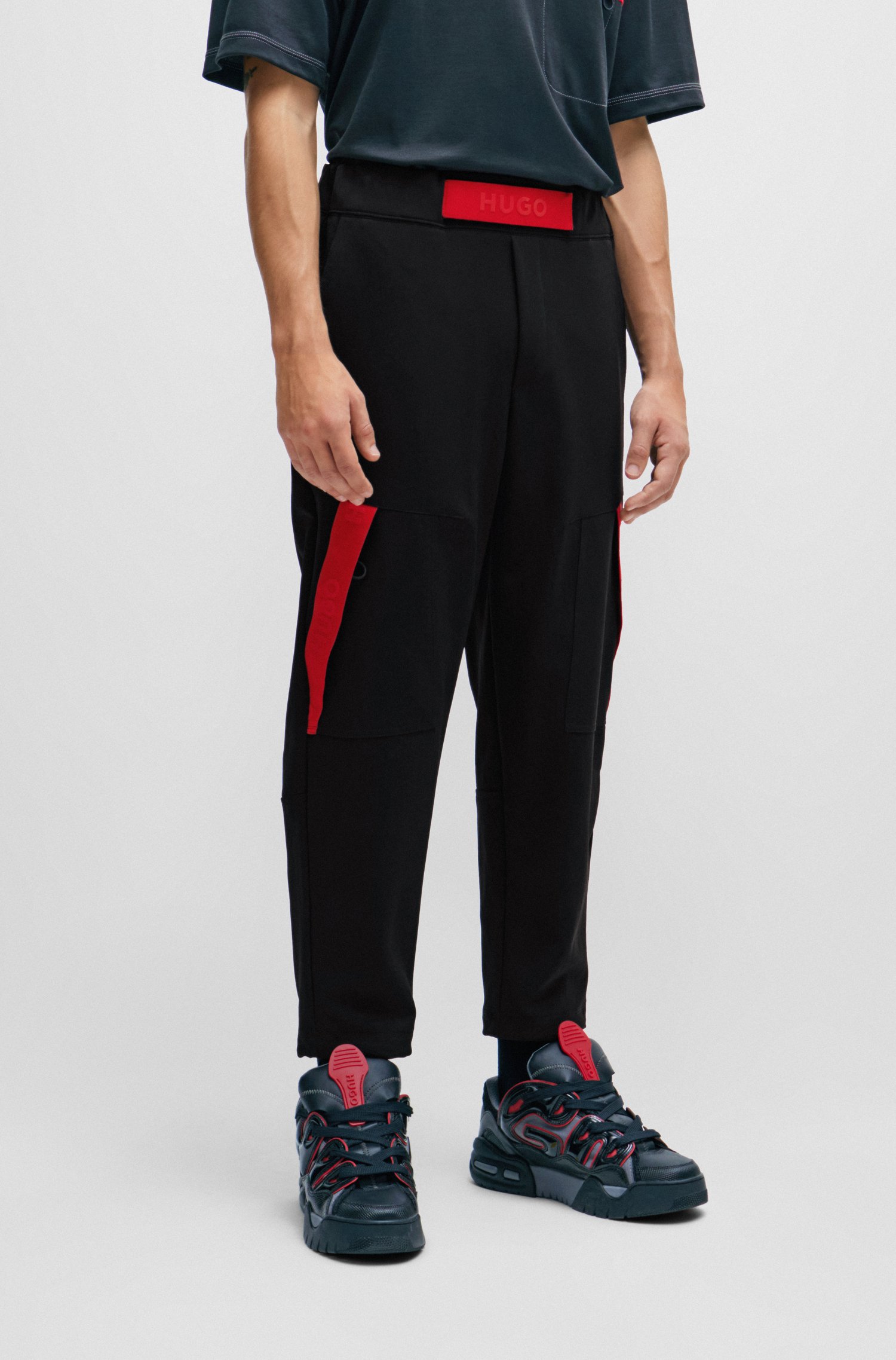Relaxed-fit tracksuit bottoms with red logo tape
