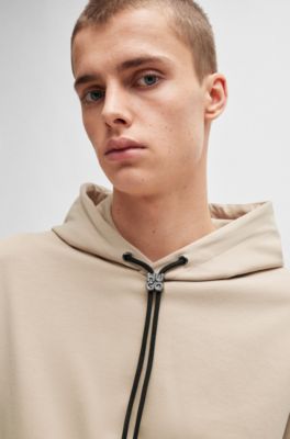 Sudadera con capucha relaxed fit en algod&oacute;n el&aacute;stico con bolsillos en contraste, Beige