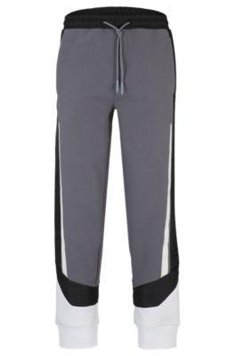 Hugo Boss Mixed-material Tracksuit Bottoms With Printed Logo In Grey