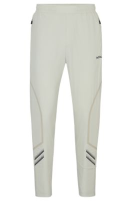 Hugo Boss Regular-fit Tracksuit Bottoms With Decorative Reflective Artwork In Light Beige