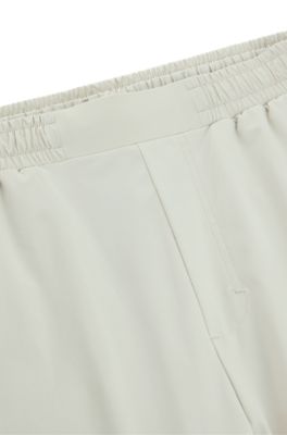 Pantalones de ch&aacute;ndal regular fit con dise&ntilde;o reflectante decorativo, Beige claro