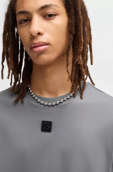 Interlock-cotton T-shirt with metallic stacked-logo badge