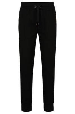 Hugo Boss Tracksuit Bottoms With Signature-stripe Trims In Black