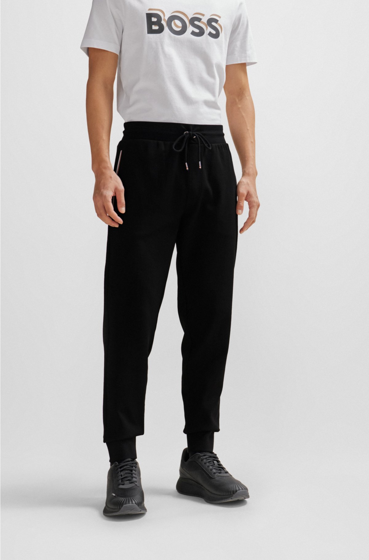 BOSS - Pantalones de chándal en felpa de algodón con raya y logo