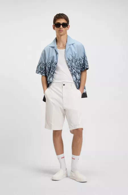 Regular-fit shorts with slim leg and buttoned pockets