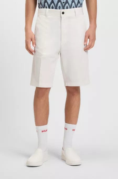 Regular-fit shorts with slim leg and buttoned pockets