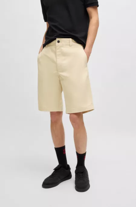 Regular-fit shorts with slim leg and buttoned pockets