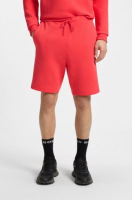 Shorts regular fit de algod&oacute;n el&aacute;stico con logo de estilo s&aacute;ndwich, Rojo claro