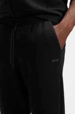 Stretch-cotton track pants with logo print, Black