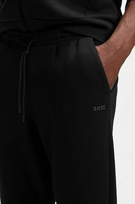 BOSS - Stretch-cotton tracksuit bottoms with logo print