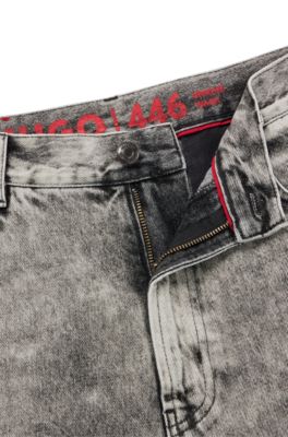 HUGO - Loose-fit jeans in bleach-wash black rigid denim